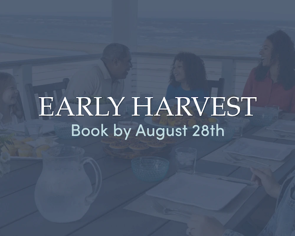 An elegant dining scene outdoors at a table with a pitcher and glasses, overlay text reads “Early Harvest” and “Book by August 28th,” serene, inviting.