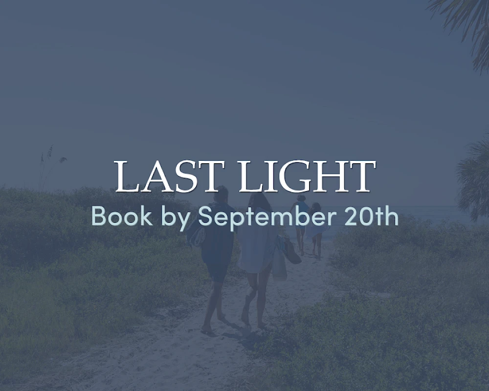 A faded blue-tinted poster for “Last Light,” with two people walking a path in a coastal landscape, and text reading “LAST LIGHT” and “Book by September 20th.”