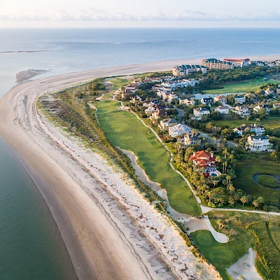 Exterior view of Sweetgrass Pool Complex, Residences at Sweetgrass and ocean in the distance.